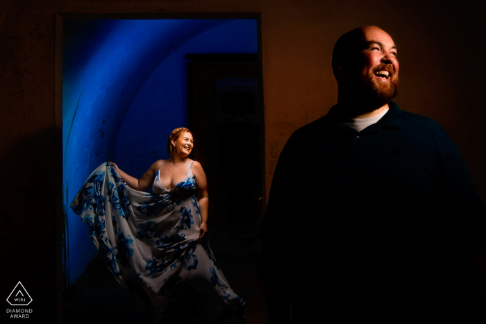 El Morro, San Juan PR wedding and engagement photographer: 3 light setup, 1 with blue gel behind the Lady and light 45 degree right for lady. One light for the guy on right at 45 degrees. 