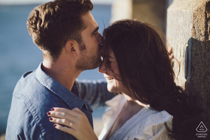 Castle Hill Lighthouse engagement shoot - A sweet kiss in front of the lighthouse where they got engaged. 