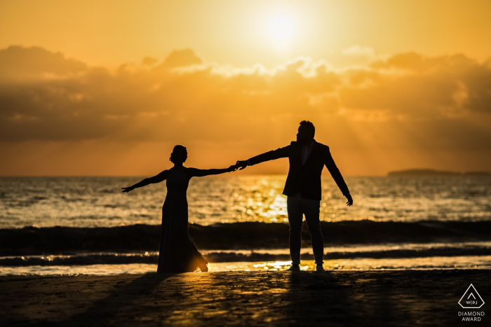 Photo by: <a href="https://www.wpja.com/photos/diamond-award-top-wedding-engagement-photographer/2579337">Juan Carlos Calderon - Puerto Vallarta Jalisco W Punta Mita Resort, Punta Mita, Mexico engagement shoot | Photo includes: couple, silhouette, water, sunset, dancing