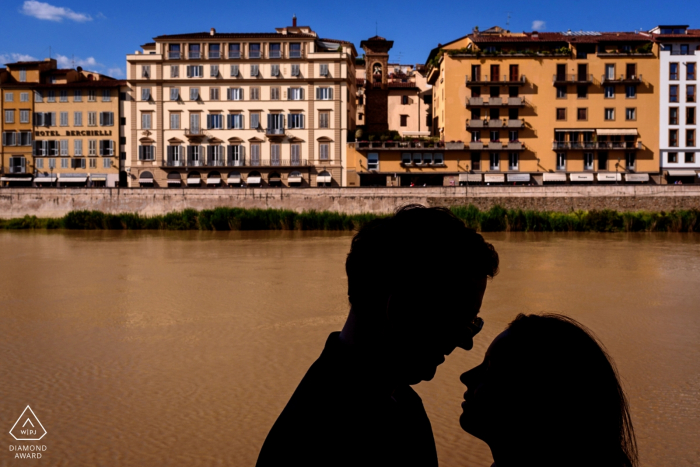 Silhouette couple portrait over the River during a city centre engagement shoot Silhouette couple portrait over River in Florence - Florence Italy city centre engagement shoot