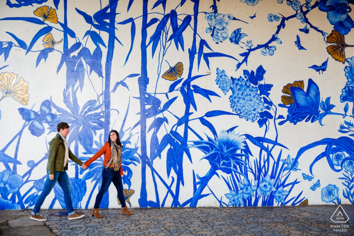 Photo by: <a href="https://www.wpja.com/photos/diamond-award-top-wedding-engagement-photographer/2579444">Victoria Sprung - Chicago Illinois Chicago Illinois Engagement Photo - ping tom park couple walking in front of a mural