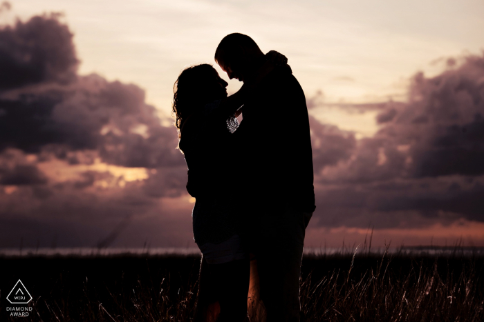 Key West Silhouette engagement Photo at Sunset with Clouds