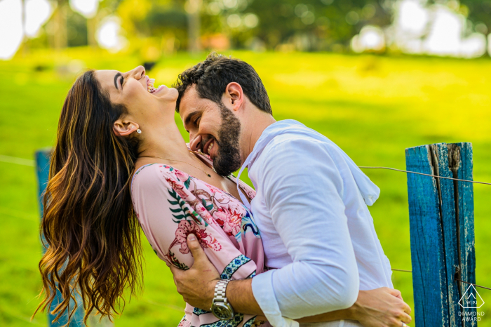 Photo by: <a href="https://www.wpja.com/photos/diamond-award-top-wedding-engagement-photographer/2579564">Vinicius Fadul - Campinas São Paulo São Paulo - Joaquim Egidio couple kissing outdoors next to farm fence