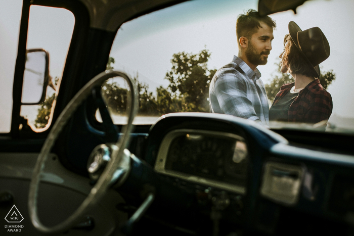 Photo by: <a href="https://www.wpja.com/photos/diamond-award-top-wedding-engagement-photographer/2579588">Emre Nesli - İstanbul Istanbul Mersin/Turkey Engagement Pre Wedding Shoot - A portrait of the couple through car window