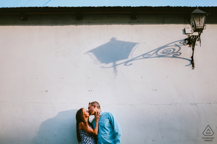 Lviv, Ukraine Couple kissing under a street light shadow - Engagement portrait session