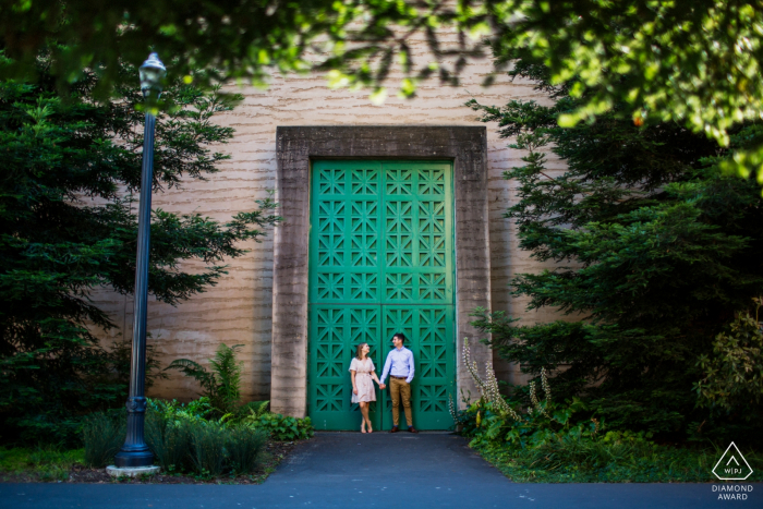 Photo by: <a href="https://www.wpja.com/photos/diamond-award-top-wedding-engagement-photographer/2579660">Chris Shum - Sunnyvale California San Francisco Engagement Shoot - Couple Holding hands by big green door.