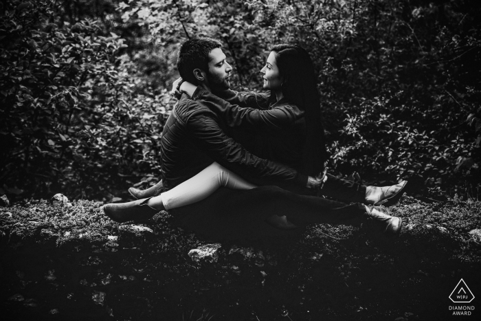 Lyon portrait of a couple sitting with legs locked together - Love session image