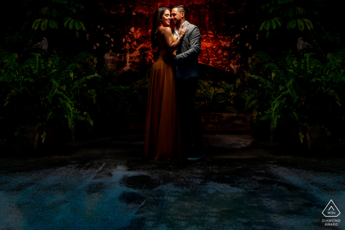 engagement photography with a Red gel in the back to sepparate couple from the background Dorado, PR engagement photographer: Red gel in the back to sepparate couple from the background.
