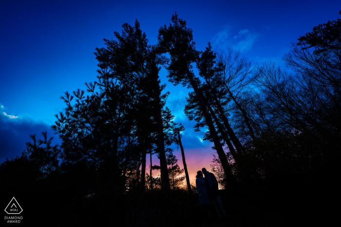 Castle Hill on the Crane Estate - Image of engaged couple at sunset 