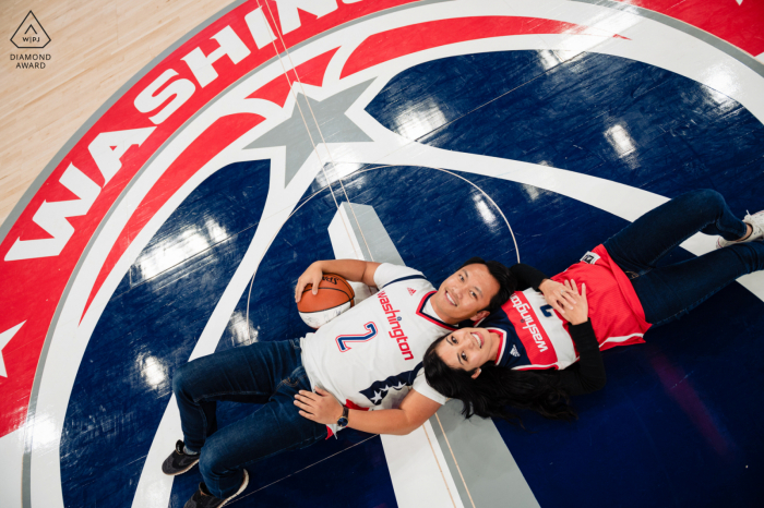Photo by: <a href="https://www.wpja.com/photos/diamond-award-top-wedding-engagement-photographer/2580454">Kathleen Ricker - Linthicum Heights Maryland Capital One Arena engagement picture - A rare, on the court photo with two wizards fans