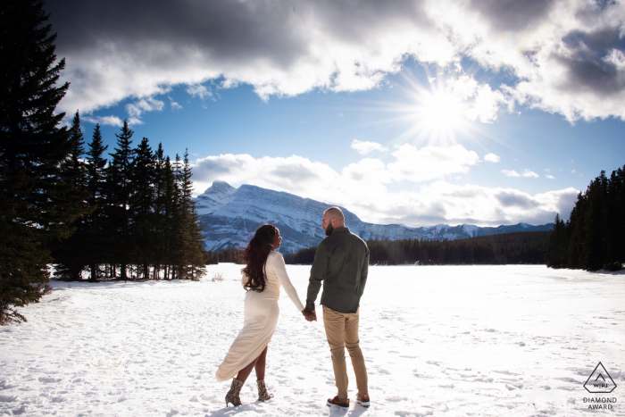 Photo by: <a href="https://www.wpja.com/photos/diamond-award-top-wedding-engagement-photographer/2580955">Sarah Manton - Olds Alberta Two Jack Lake Banff National Park Alberta Canada - A sunny but windy day for a mountain engagement session.
