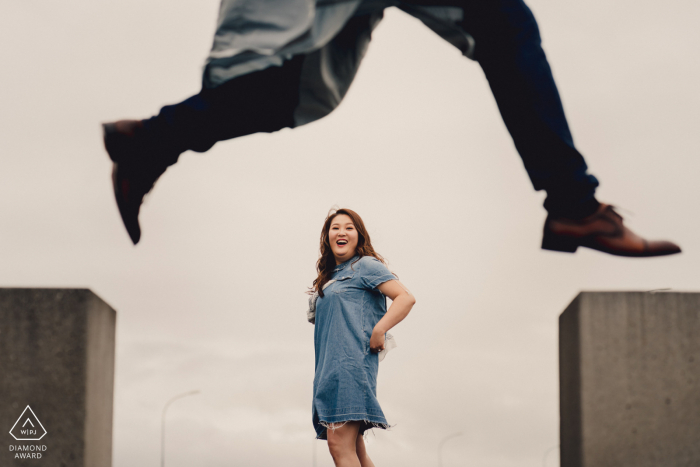 Engagement Photographer | Iceland Man jumping over lady 