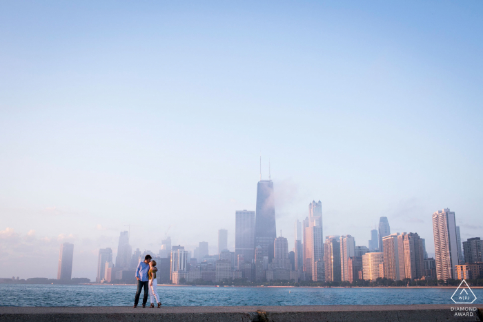 Photo by: <a href="https://www.wpja.com/photos/diamond-award-top-wedding-engagement-photographer/2581175">Heather DeCamp - Los Angeles California Couple Engagement Photo Session | chicago couple at sunrise at north avenue beach