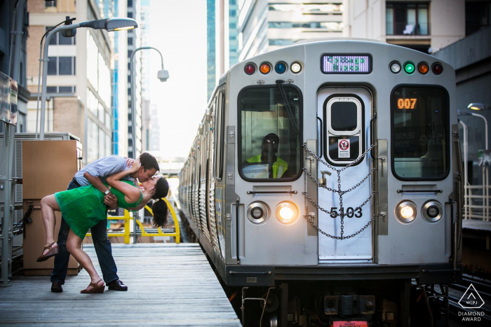 Engagement Picture Session dip as a CTA train approaches the State/Lake CTA station in downtown Chicago.