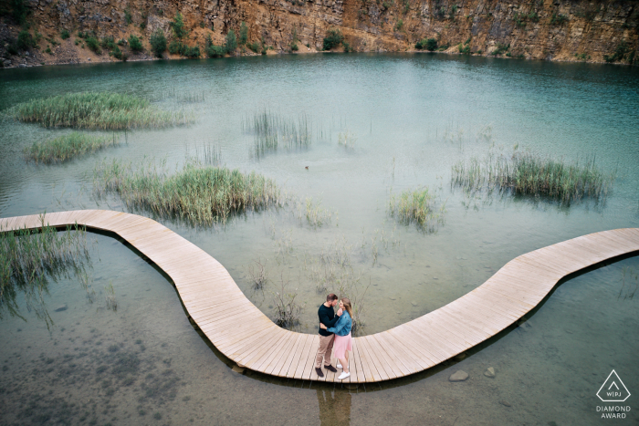 Park Gródek, Jaworzno, Poland - Engaged couple on a wooden path in an old stone pit 