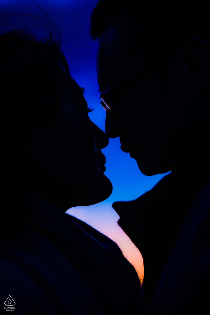Photo by: <a href="https://www.wpja.com/photos/diamond-award-top-wedding-engagement-photographer/2581664">Wenjie Han - Long Island City New York Castle Hill on the Crane Estate engagement portrait at sunset with a silhouetted couple