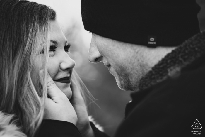 The man embraces his fiance during their engagement session near Lake Dillon in Dillon, CO. 