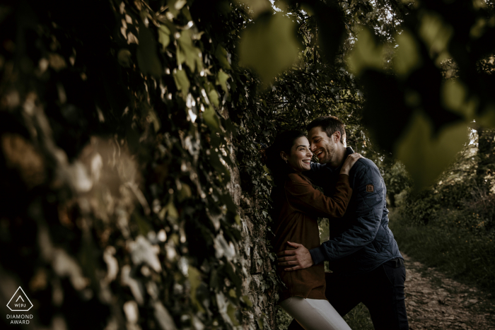 a prewed love session of a couple within trees Lyon prewed love session of a couple within trees