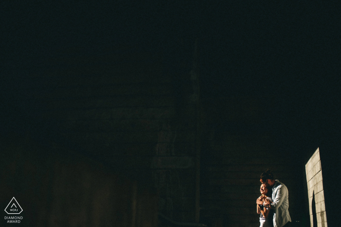 London pre-wedding shoot of a couple with strong sunlight cast upon them