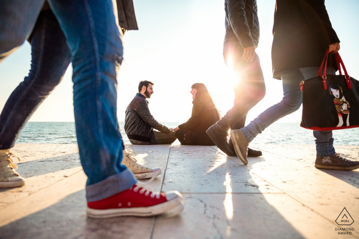 Photo by: <a href="https://www.wpja.com/photos/diamond-award-top-wedding-engagement-photographer/2582379">Lisa Pacor - Trieste Trieste Grado, Italy engagement couple portrait - Smiles and sunshine on the boardwalk
