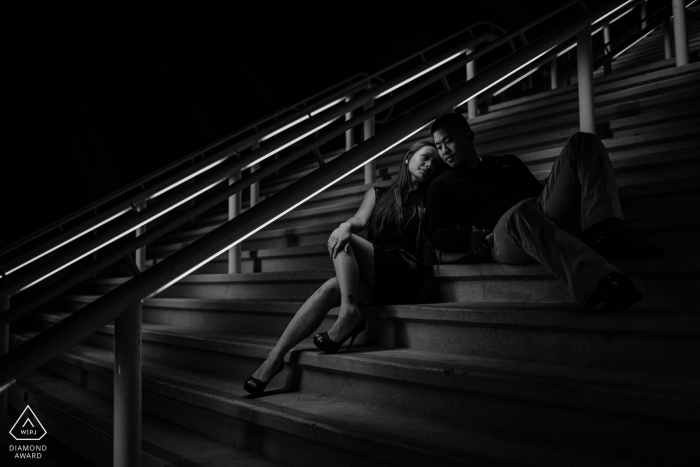 Engagement photography of a couple of stairs at night in San Diego, CA