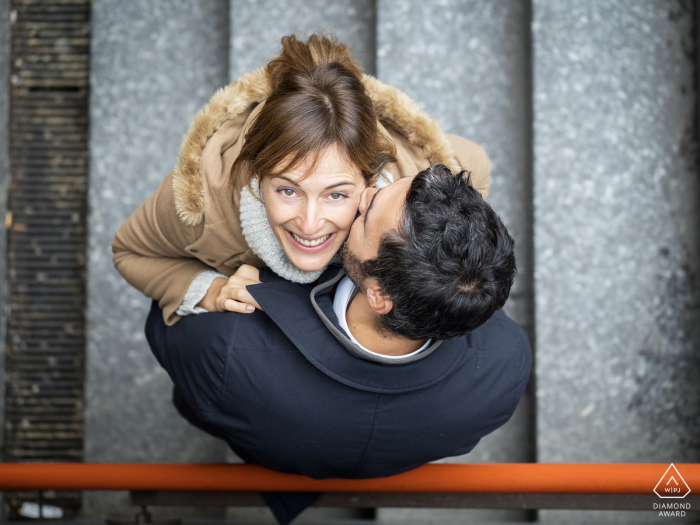 engagement photo shot overhead looking down on the couple on stairs Lombardy engagement photo shot overhead looking down on the couple on stairs