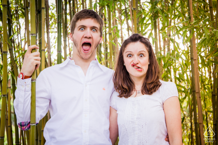 A couple is making a funny face during portrait session in Japanese garden at Toulouse