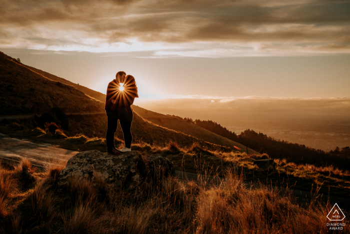 Port Hills, Christchurch engaged Couple at Sunset in the hills for a New Zealand portrait session