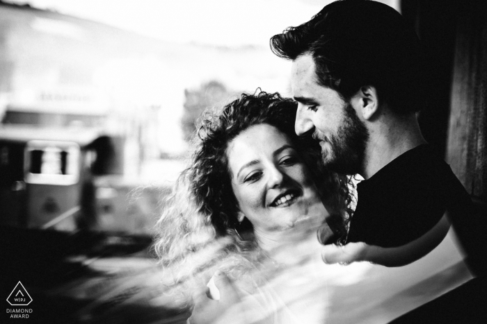 an Engaged couple pose for a black and white, creative portrait Hafen Stuttgart Engaged couple pose for a black and white, creative portrait