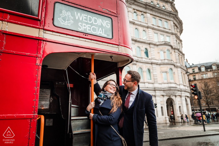 London, UK engagement portrait session with a Little gift by the red bus driver - a Wedding Special, sign