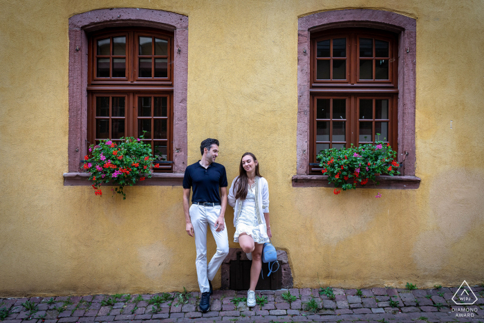 Riquewihr - Alsace couple portraits in the village streets with windows and planters Riquewihr - Alsace couple portraits in the village streets with windows and planters
