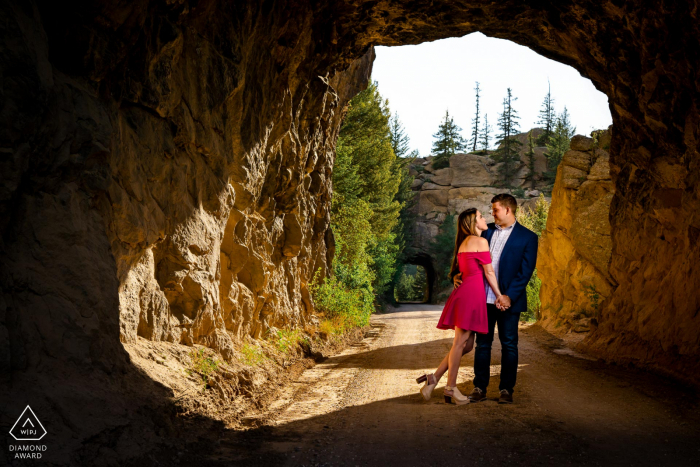 a couple embrace at Eleven Mile Canyon in Lake George, CO during their engagement photography shoot