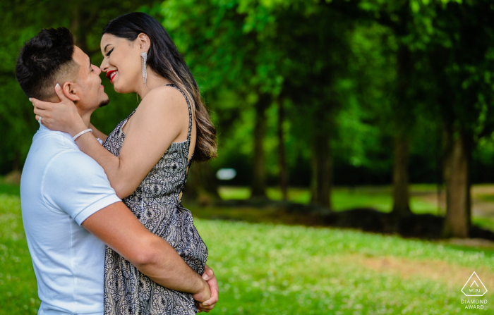 Holding his fiance close to him in a very romantic engagement portrait at Founder's Park, Farragut, TN