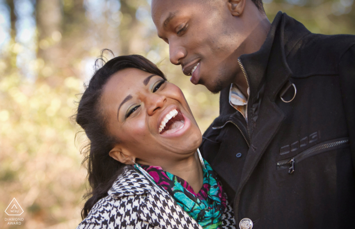 Stone Mountain Park Fiance's laughing together during engagement portraits