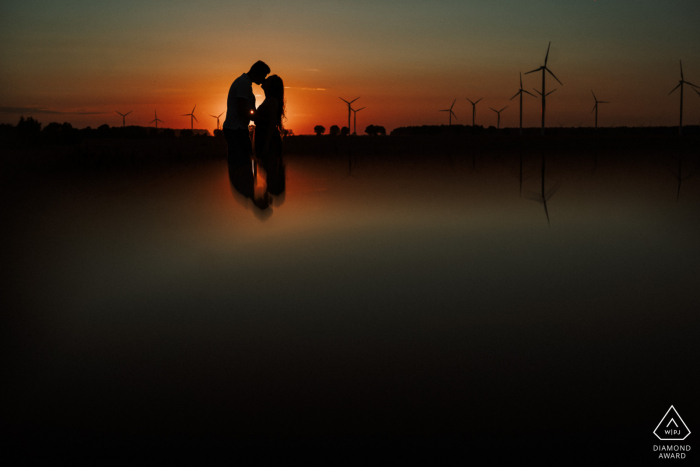 aCouple holding each other in Pobłocie Wielkie during engagement shoot