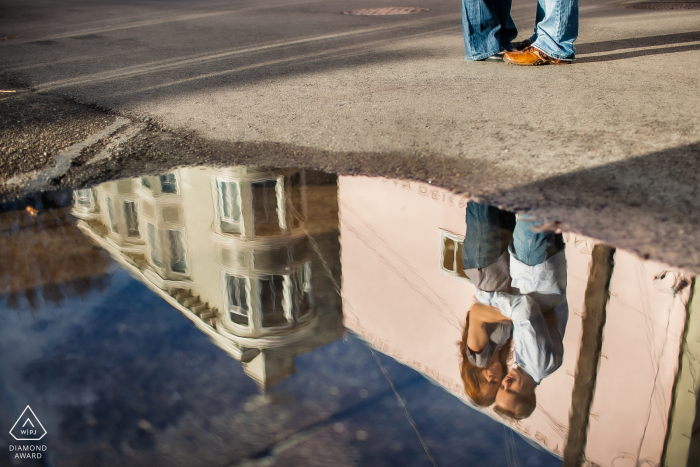 San Francisco Love in the puddle reflection during a pre-wedding photo session San Francisco Love in the reflection during a pre-wedding photo session