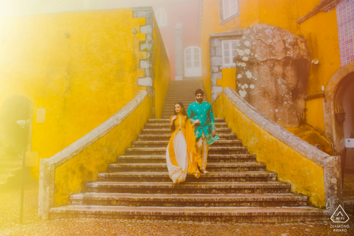 Bright sunlight couple engagement image from the Pena Palace in Sintra, Portugal