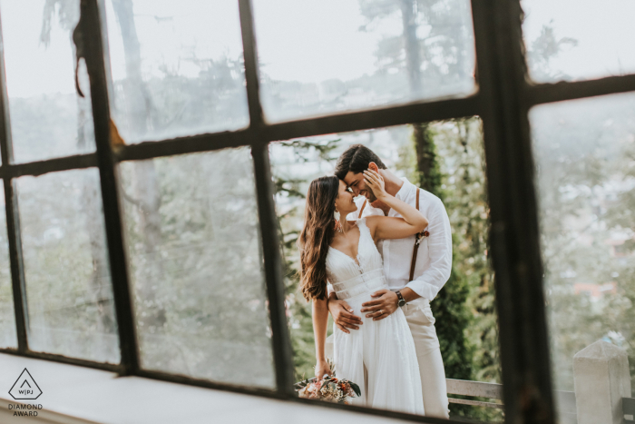 Istanbul romantic engagement portraits shot through damaged windows