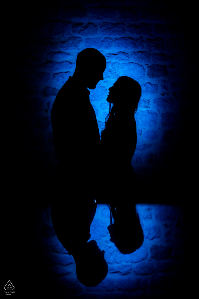 South of France Engagement portrait with a back light flash and iPad reflection at Castelnau de Montmiral 