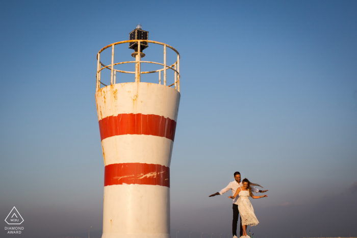 Izmir, Turkey sea light flying couple portrait session by the lighthouse tower