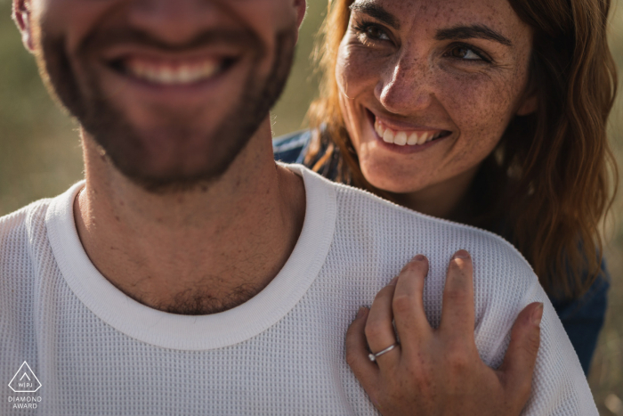 Pleumeur Bodou pre-wedding photography of the couple smiling in the warm sunlight