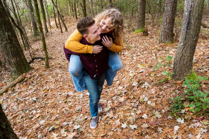 GA engagement photoshoot & pre-wedding session at Smithgall Woods, Helen, GA of a Piggyback ride GA engagement photoshoot & pre-wedding session at Smithgall Woods, Helen, GA of a Piggyback ride