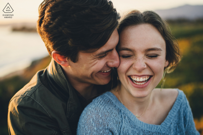 California engagement photo shoot of a couple laughing together in Santa Clara, CA 