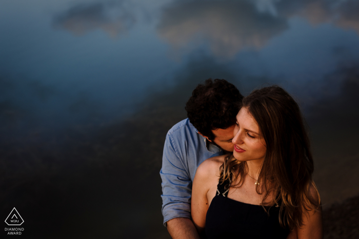 FR engagement portrait with a posed couple on the water of Montpellier France