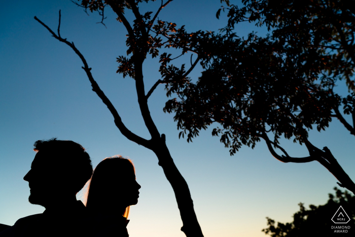 IT engagement portrait with a posed couple from Duino, Trieste, Italy showing off their Silhouettes