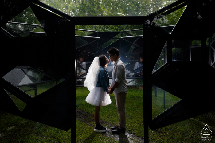 red brick art gallery during an engagement portrait session with some Love in the rain 