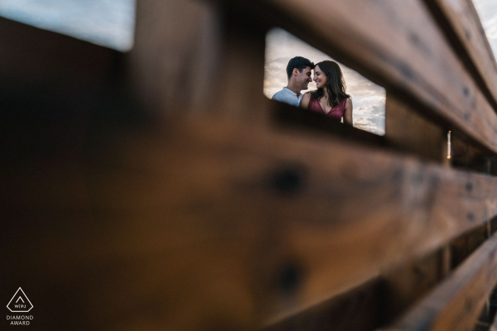 Puglia mini framed couple photo session before the wedding day with a wooden bench