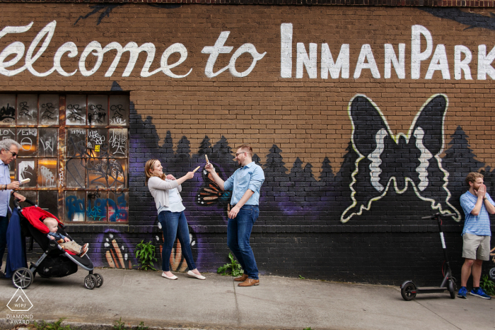 Little Five Points, Atlanta urban couple portrait with some fun dueling with Popsicles on the streets