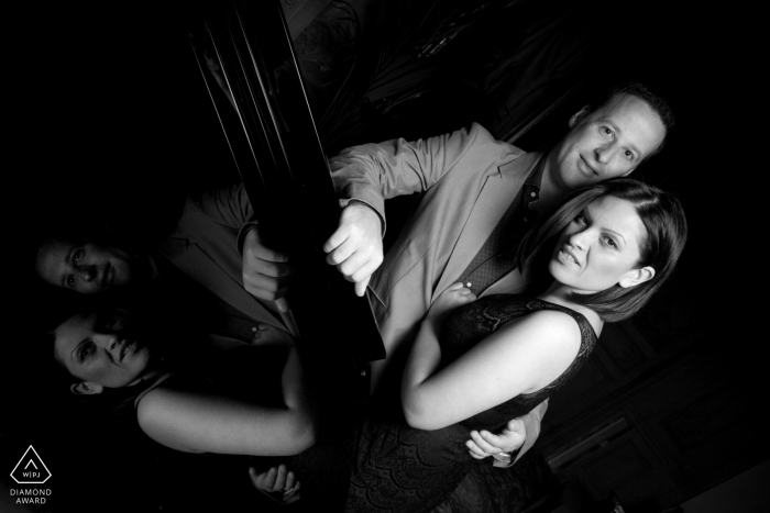 Luton Hoo, Hertfordshire black and white couple portrait. Photographer said: There was a piano in the corner of the tea-room. Largely in darkness, I used a softbox flash trigger to light the scene a little more but also to get more of a reflection Luton Hoo, Hertfordshire black and white couple portrait. Photographer said: There was a piano in the corner of the tea-room. Largely in darkness, I used a softbox flash trigger to light the scene a little more but also to get more of a reflection
