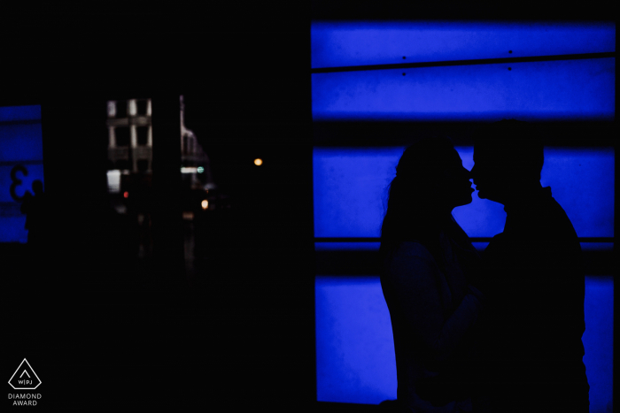 London, UK couple portrait with blue video screen backdrop